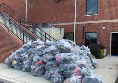 96 bags of shoes with 25 pairs each bag to be donated to those in need