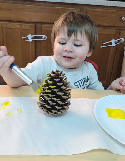 decorating a pine cone